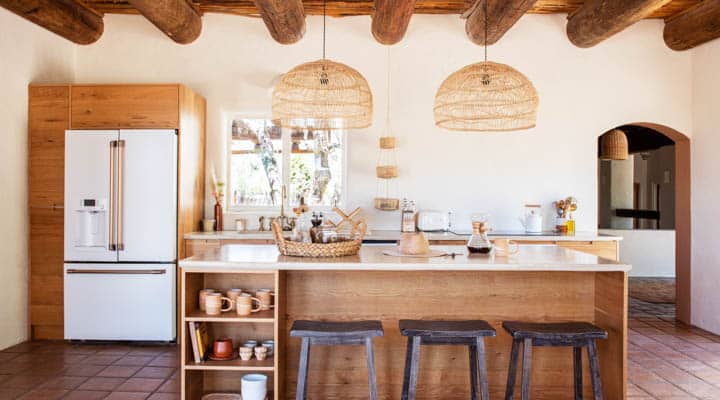 A kitchen with wooden cabinets