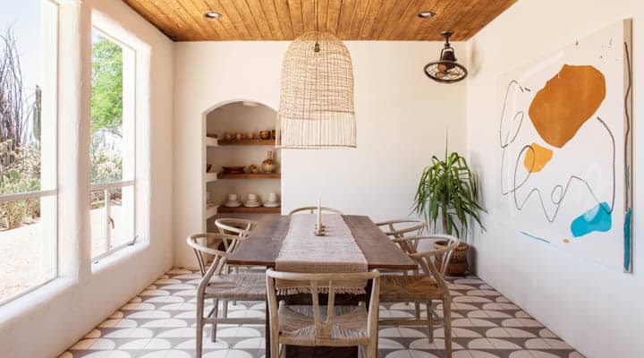 A dining room table in front of a window