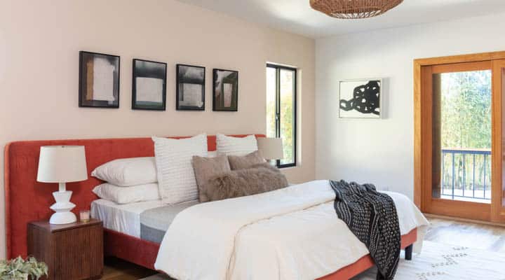 A bedroom with a large bed in a hotel room