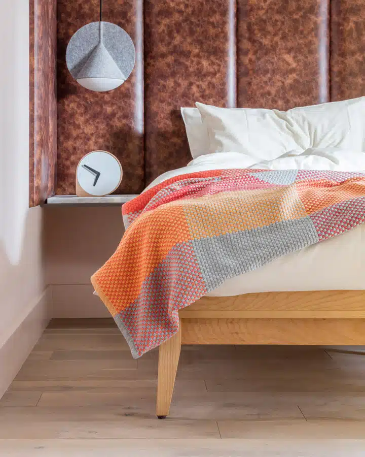 Eden-Locke-studio-bedroom A made bed in a room