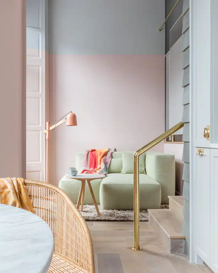 Eden-Locke-studio-lounge A bedroom with a bed and a chair in a room