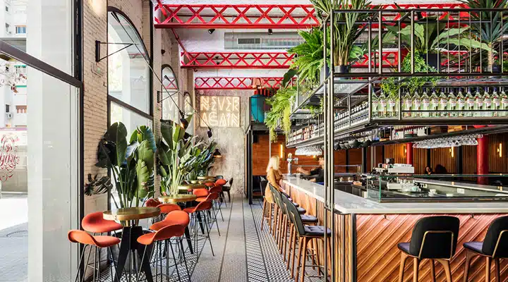 El-Mama-3-720x400 A dining room table in front of a building