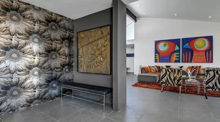 FAMILY_ROOM_SITTING_CORNER_TO_LIVING_ROOM-720x400 A group of people in a room