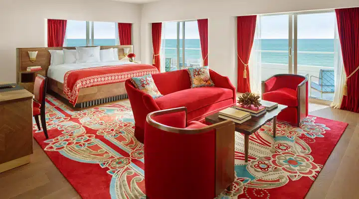 Faena-Suite_Bedroom_Photo-by-Nik-Koenig A living room filled with furniture and a large window