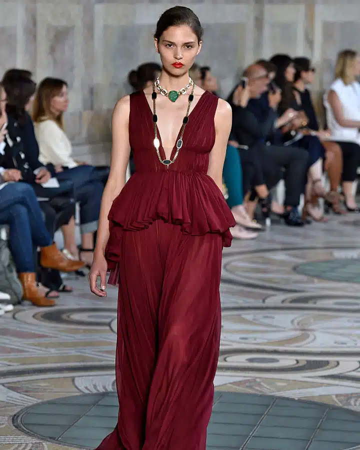 GettyImages-808191158 A person standing in front of a building