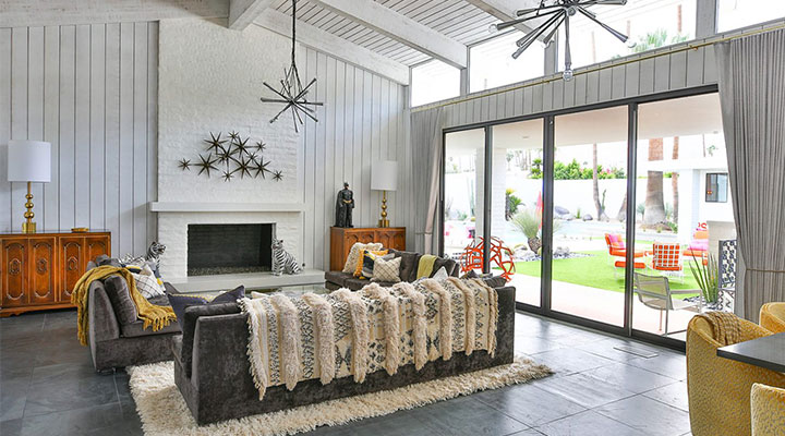 A living room filled with furniture and a large window