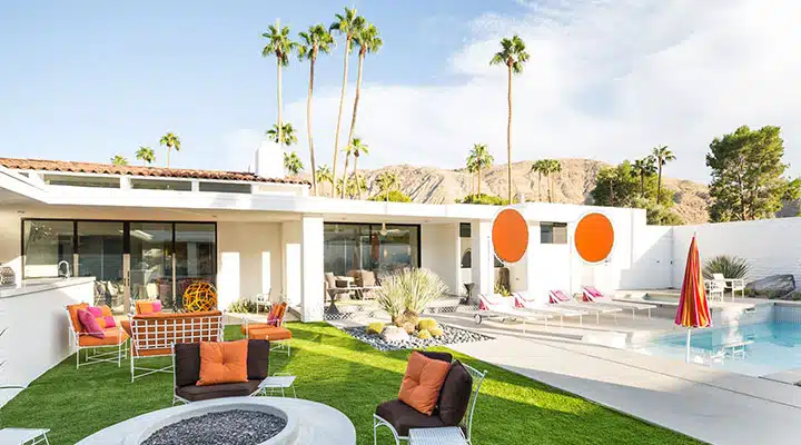 GoldenState_ModernismWeek_10 A group of lawn chairs sitting on top of a picnic table