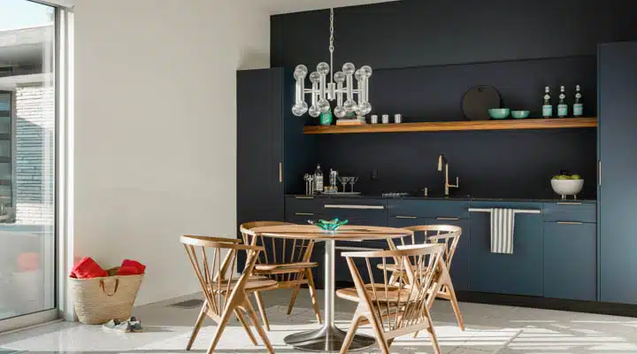 Guest_House_1-720x400 A kitchen with a table in a room