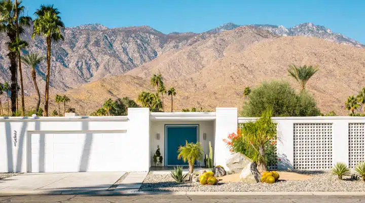 Guggenheim_House_Grace_Home_Furnishings-720x400 A vase of flowers sitting on top of a mountain