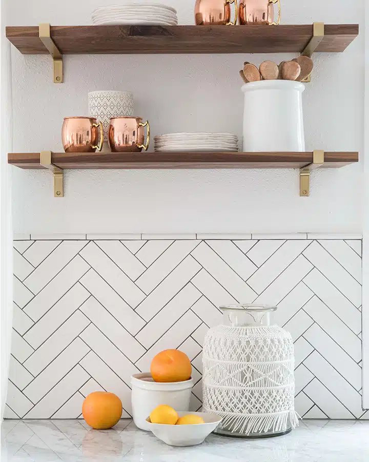 HL7A1090-Edit-720x900 Two oranges sitting on top of a table