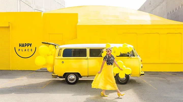 Happy-Place-Exterior A school bus parked in front of a building