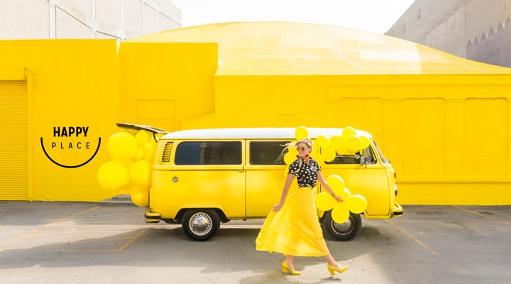 Happy-Place-Exterior A school bus parked in front of a building