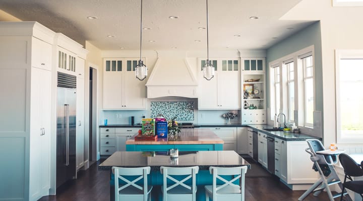 A kitchen with a blue chair