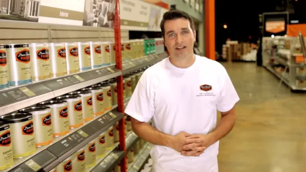 A man standing next to a machine