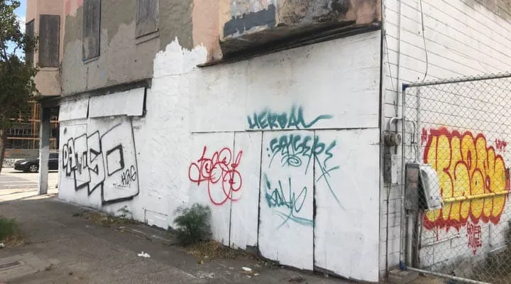 IMG-9187-720x400 A building with graffiti on the side of the street