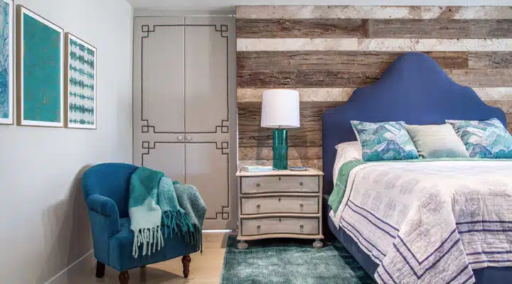 IMG_0068 A bedroom with a bed and a chair in a room