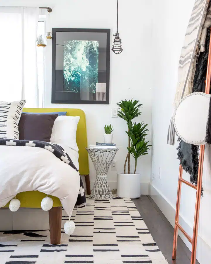 IMG_0079 A bedroom with a bed and a chair in a room