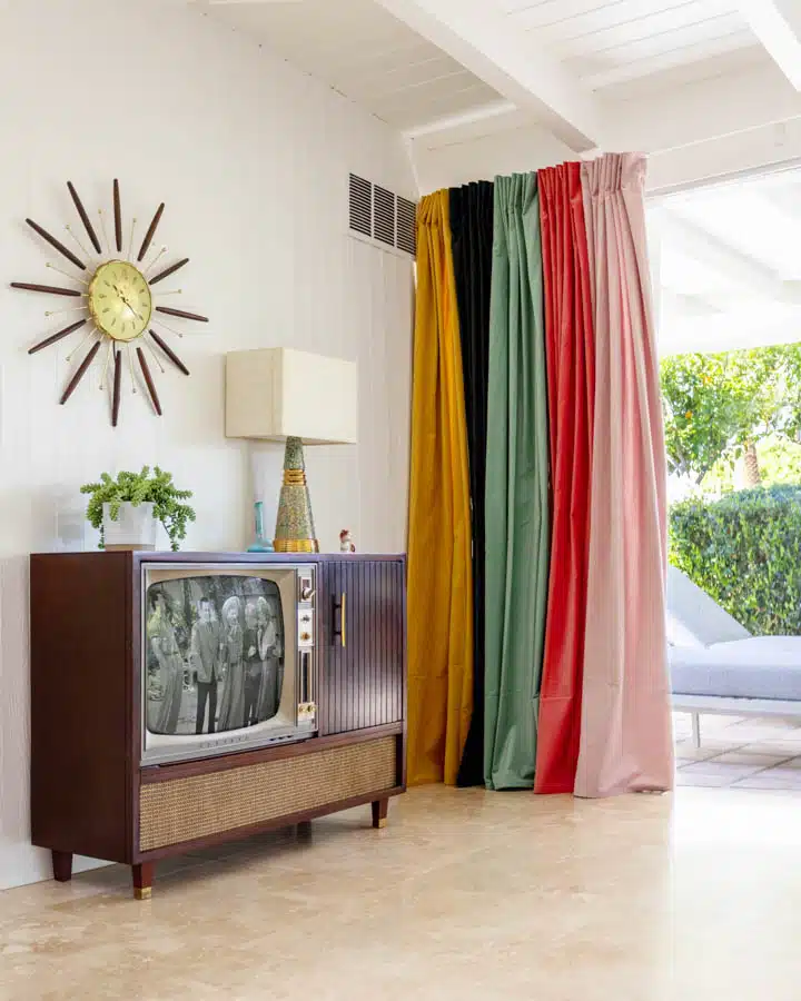 IMG_0157-720x900 A living room filled with furniture and a curtain