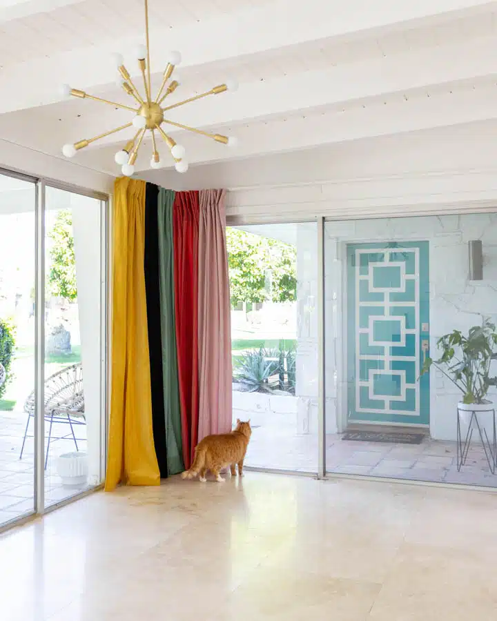 IMG_0220-720x900 A living room filled with furniture and a large window