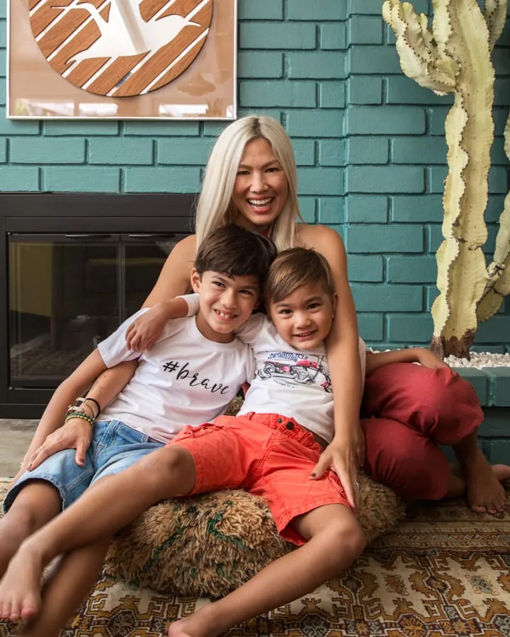 IMG_0446 A boy and a girl sitting on a bed