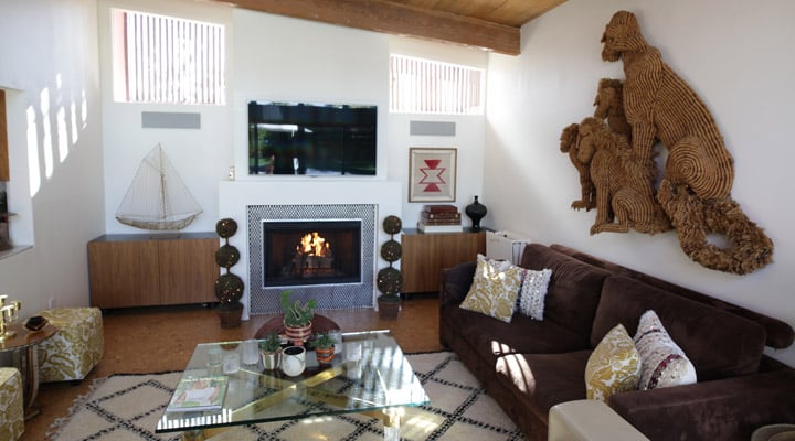 A living room filled with furniture and a fire place