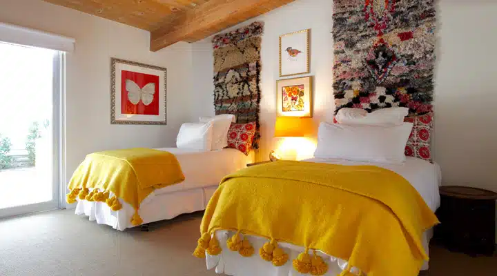 IMG_2073-_1_ A bedroom with a bed and desk in a room