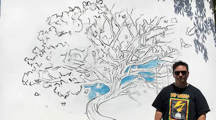 IMG_4263-720x400 A man holding a sign