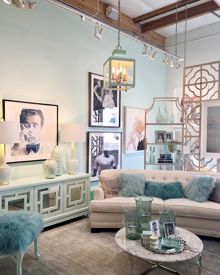 A living room filled with furniture and a mirror