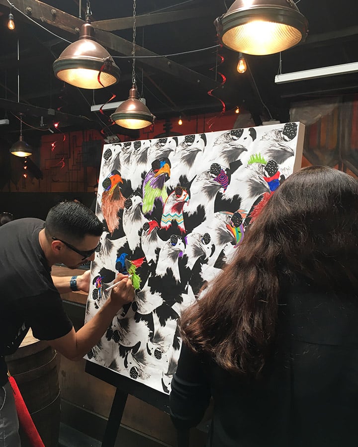 A man and a woman taking a selfie in a room
