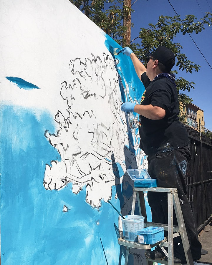 A man standing in front of a mountain