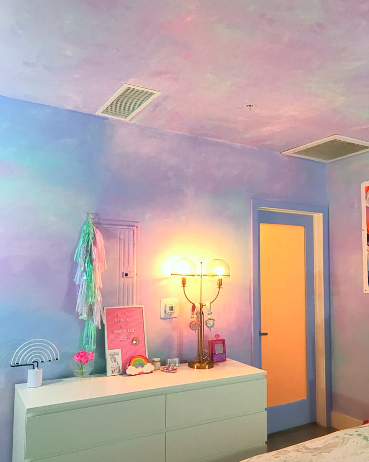 A bedroom with a bed in a room