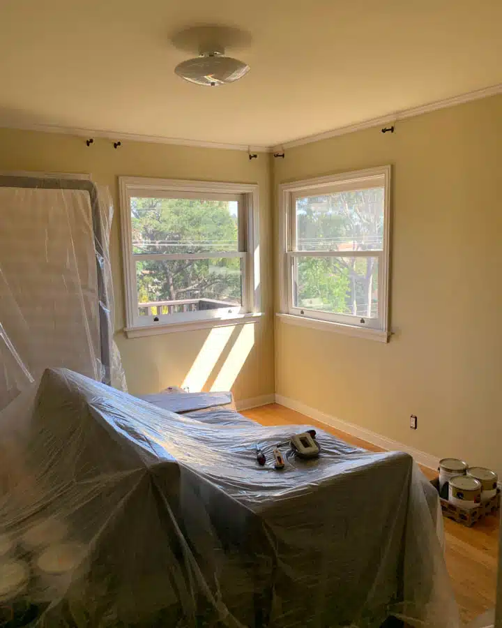 IMG_7890-720x900 A bedroom with a bed and a window