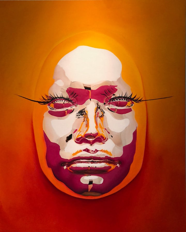 An orange hanging from the ceiling