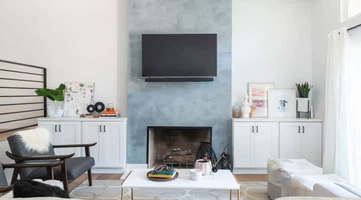 A living room filled with furniture and a fireplace