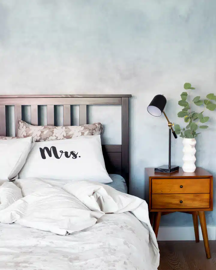 LHDesigns_LongBeach_MasterBed1-720x900 A bedroom with a large bed in a room