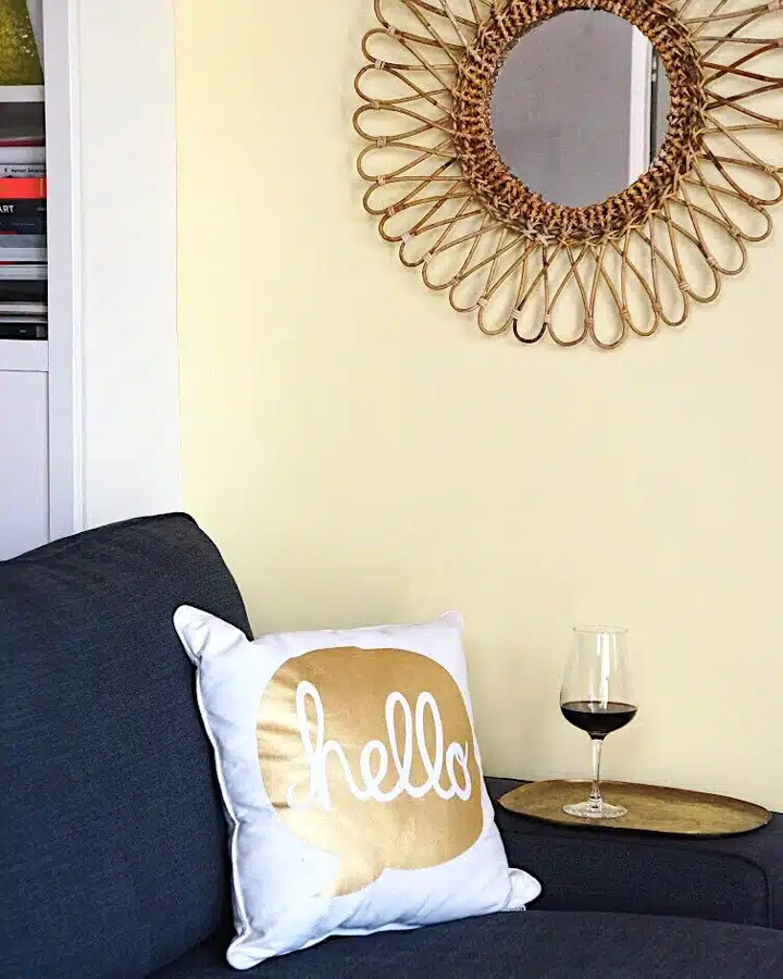 Light-COlors_Yellow A bedroom with a bed and a table