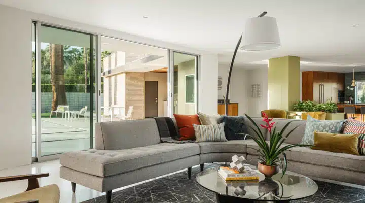 Living_4-720x400 A living room filled with furniture and a large window