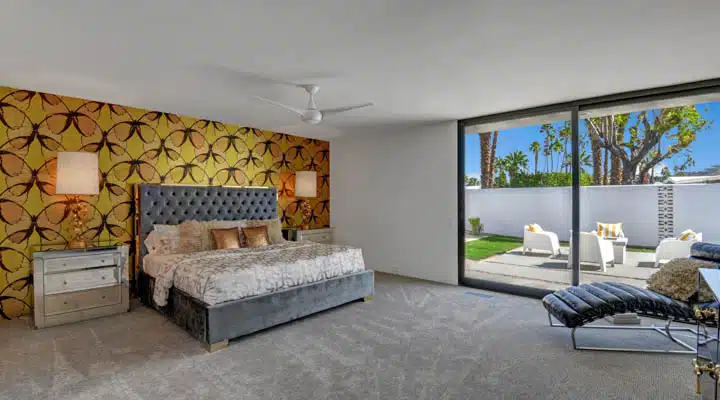 MASTER_BEDROOM-720x400 A living room filled with furniture and a fireplace