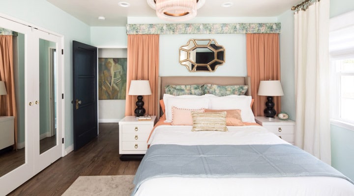 A bedroom with a bed in a room