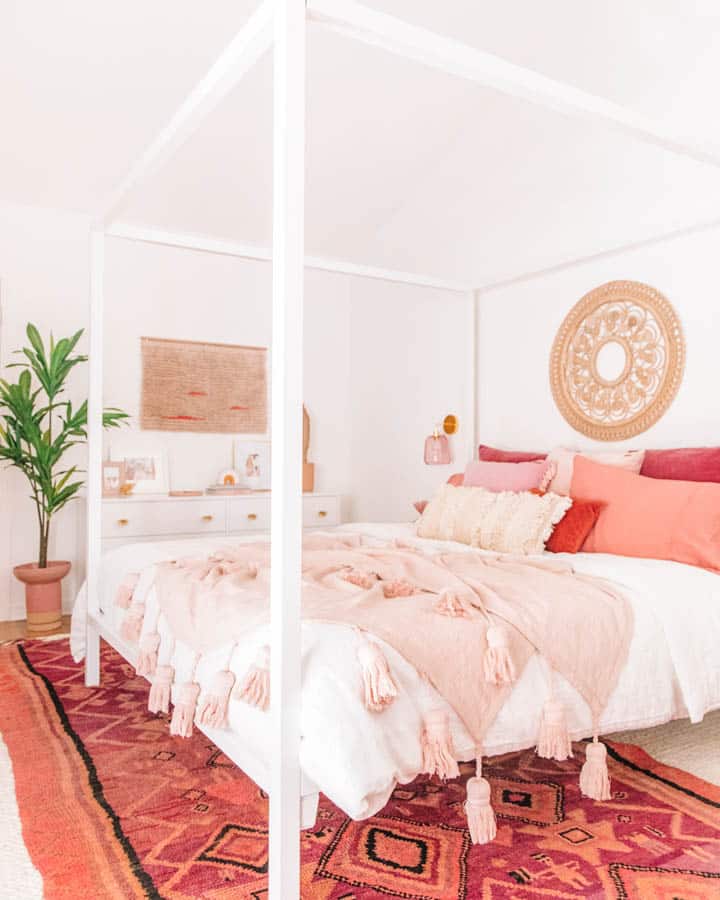 A bedroom with a bed in a room