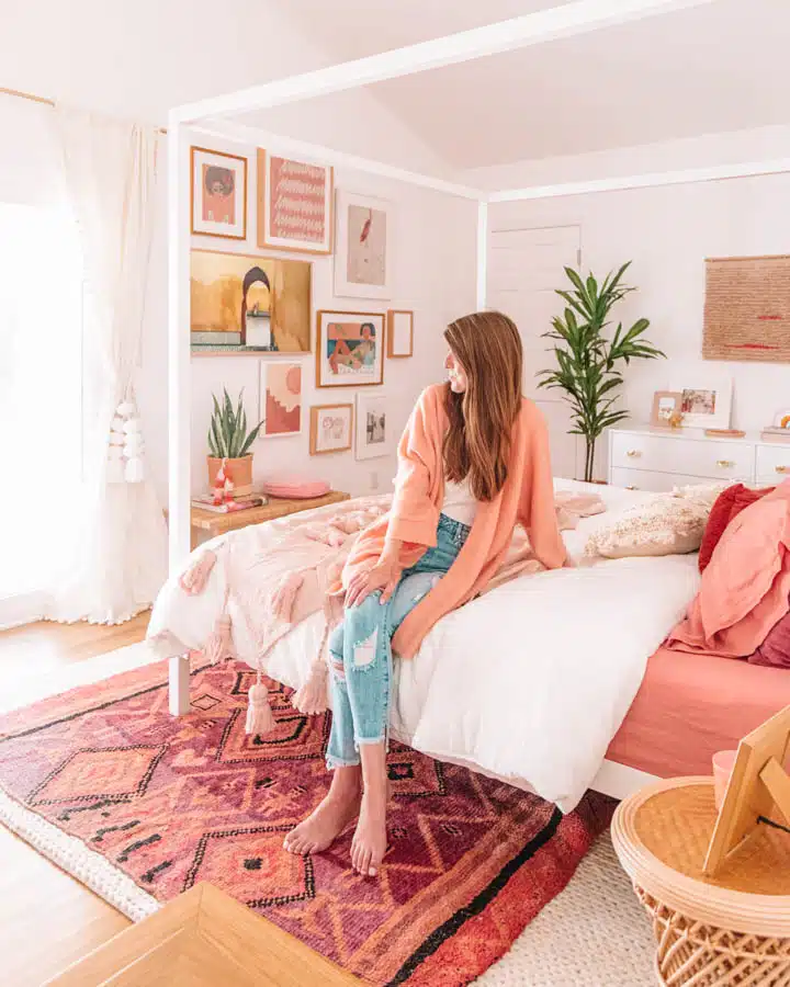 Master_Bedroom_Reveal__blog_size_-37-720x900 A woman sitting on a bed