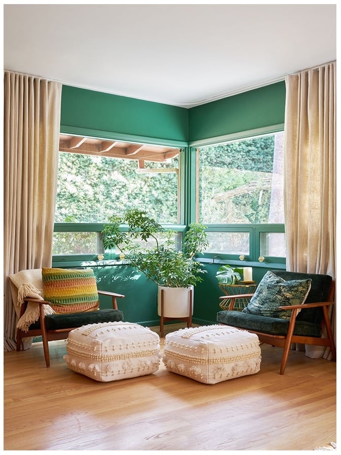 A room filled with furniture and a large window