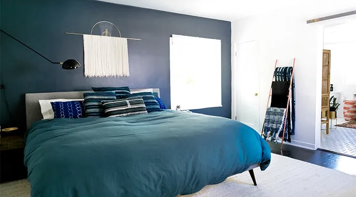 Monica-Wang-Photo-21-720x400 A bedroom with a large bed in a room