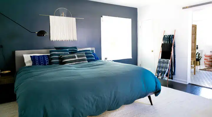 Monica-Wang-Photo-21_720x400 A bedroom with a bed in a room