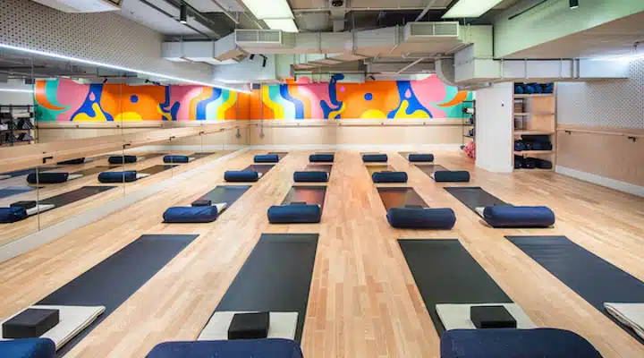 Mural_for_FRAME_Gym_in_Angel_London._Photo_taken_by_Dan_Weill-720x400 A group of people in a room