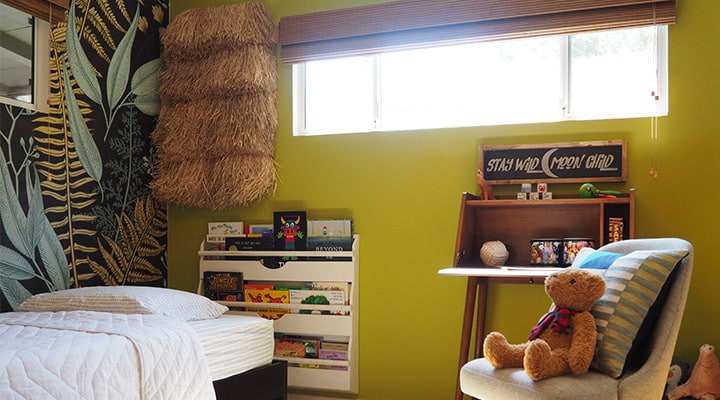 A bedroom with a bed in a room