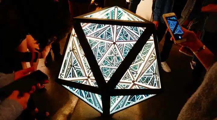 Portal_Icosahedrons_-720x400 A group of people in a room