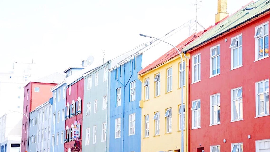 A train is parked on the side of a building