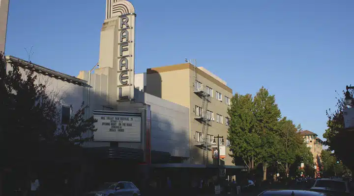 Rafael-Theater_ext1 A sign on the side of a building