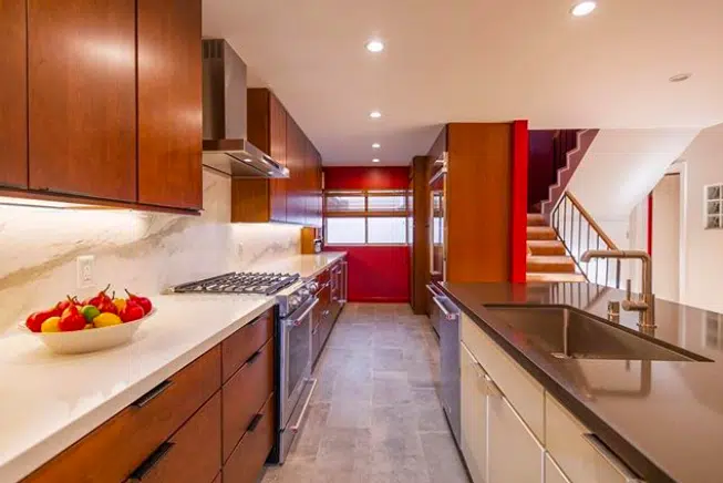 Red_Kitchen A modern kitchen with stainless steel appliances and wooden cabinets